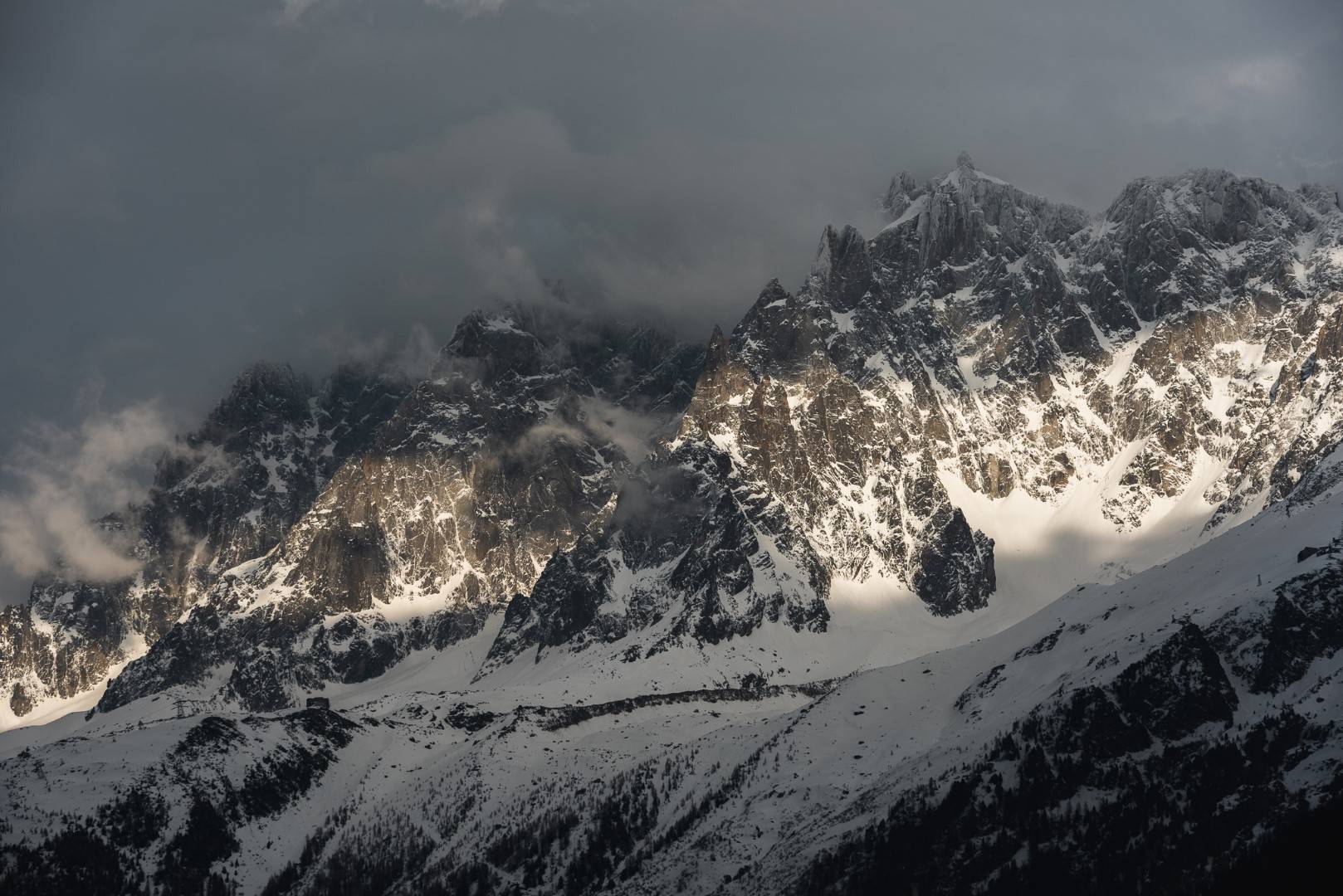 Le Drus Chamonix Valley mountains in snow and cloud